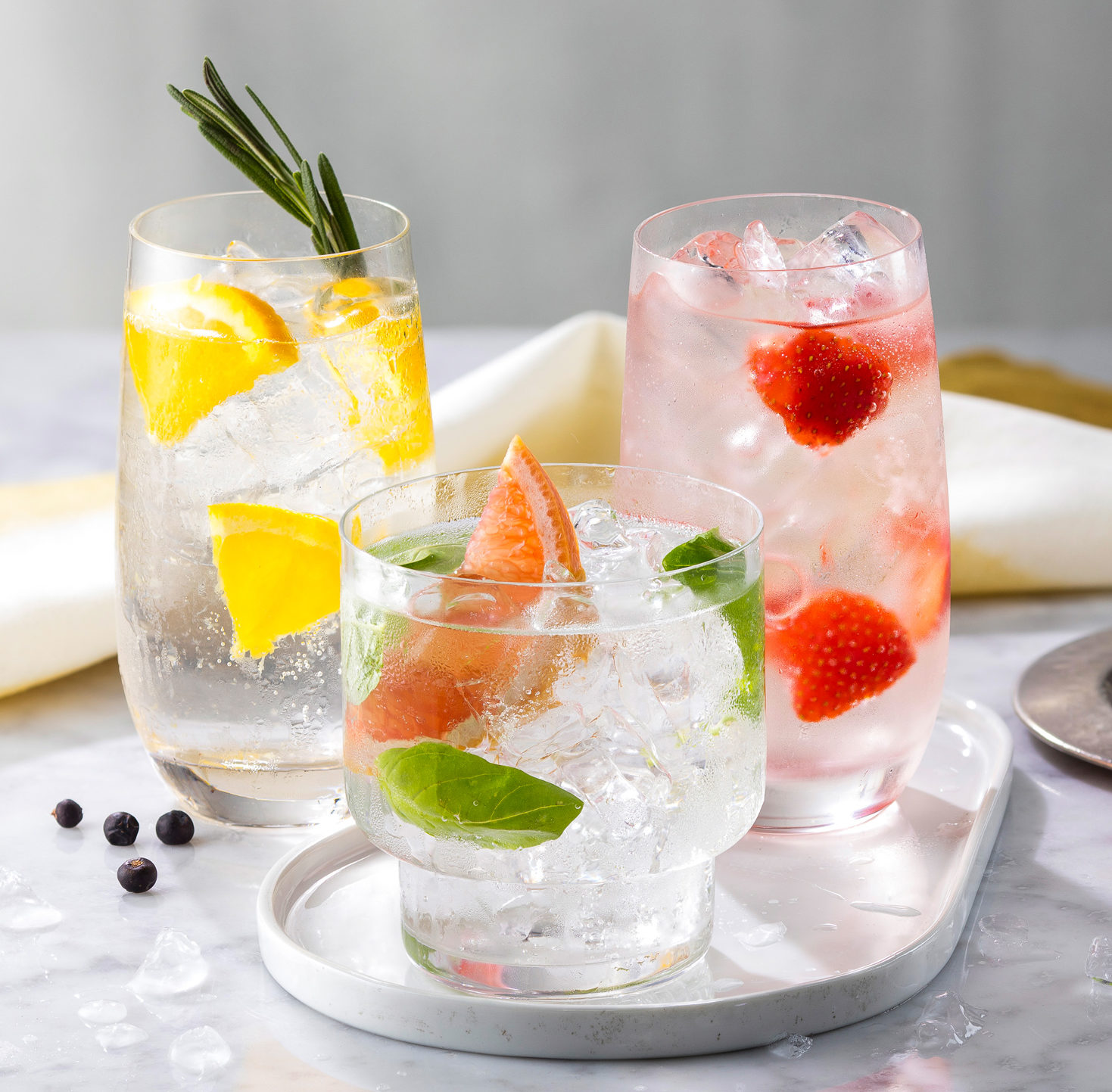 GIN&TONIC, G&T, Gin and Tonic, highball glasses, rocks glasses, garnishes, lemon, strawberry, orange, juniper, cocktail, cocktails,