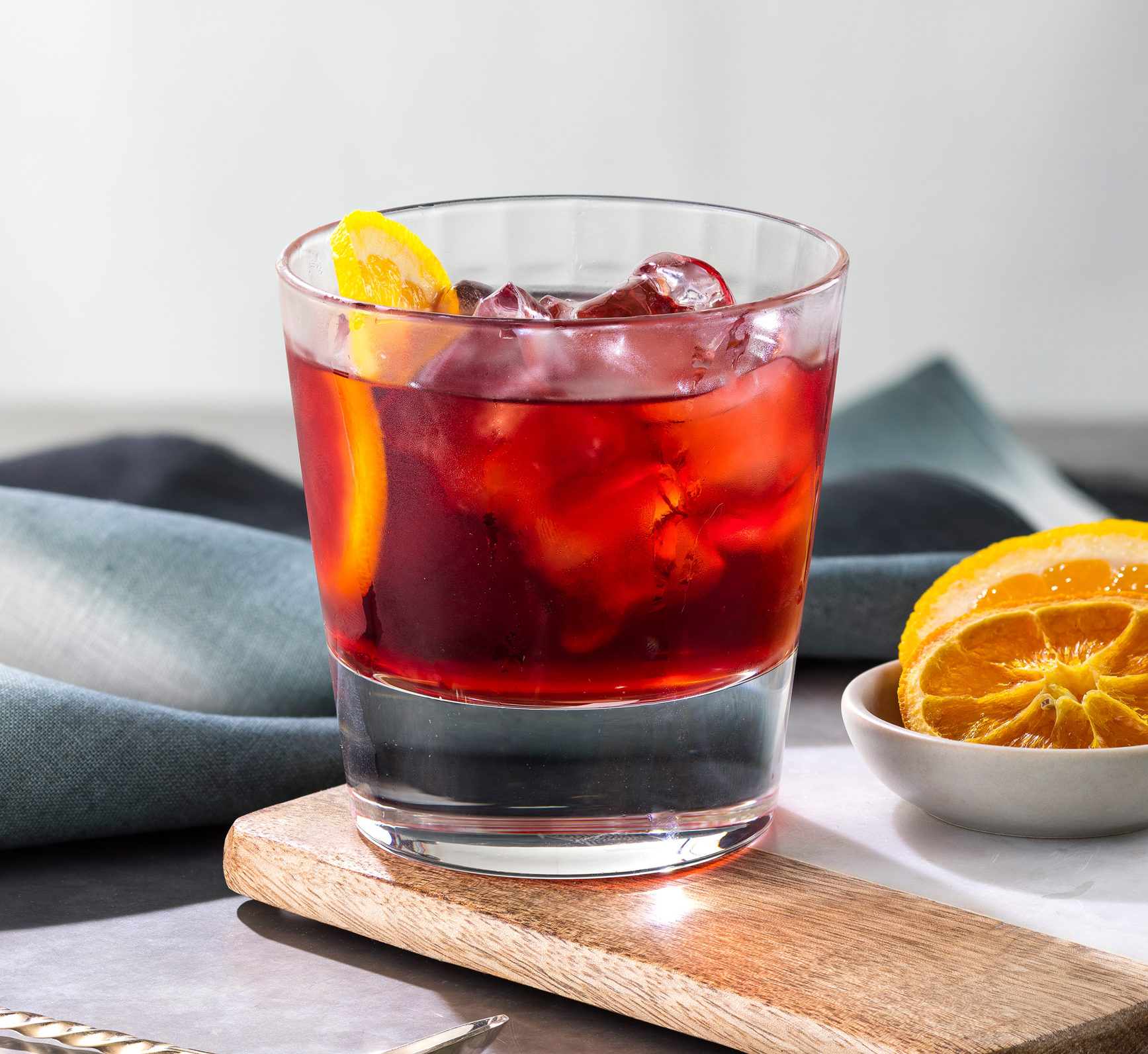 Negroni, gin cocktail, gin, cocktail, orange wedge, orange garnish, rocks, rocks glass, red cocktail,